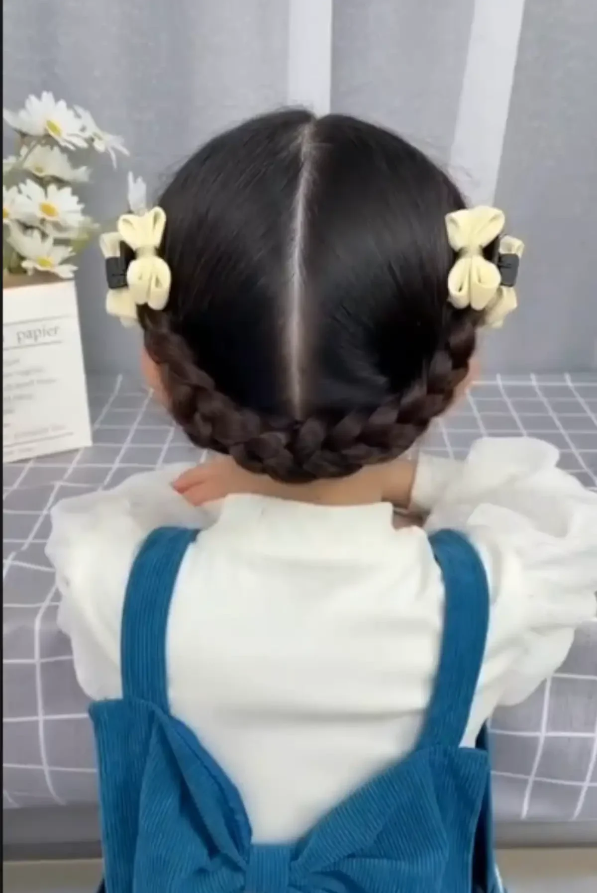 Trenza baja cruzada en la nuca